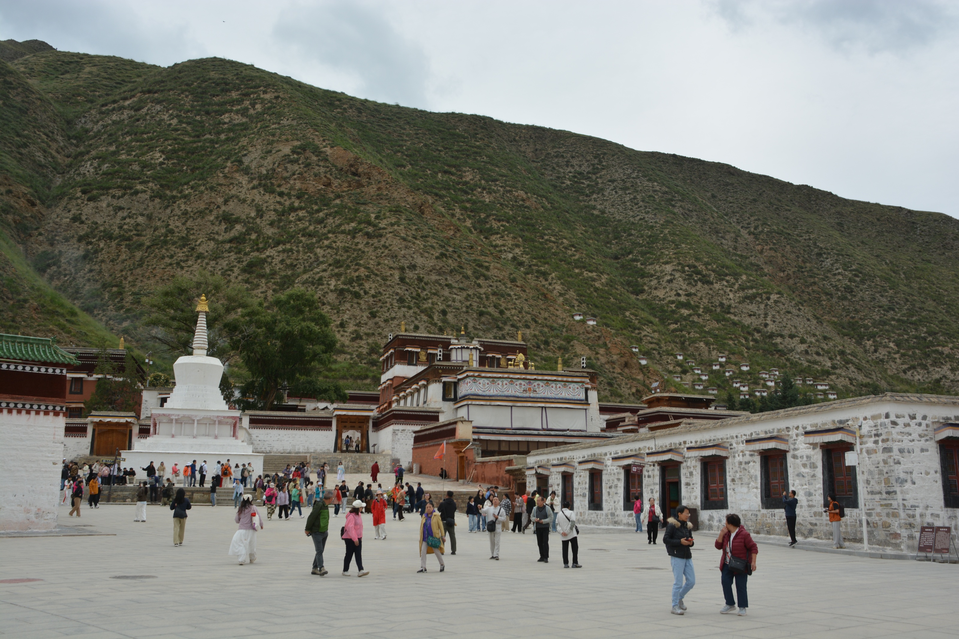Visitors and monastery buildings at Labrang Monastery in Xiahe, Gannan