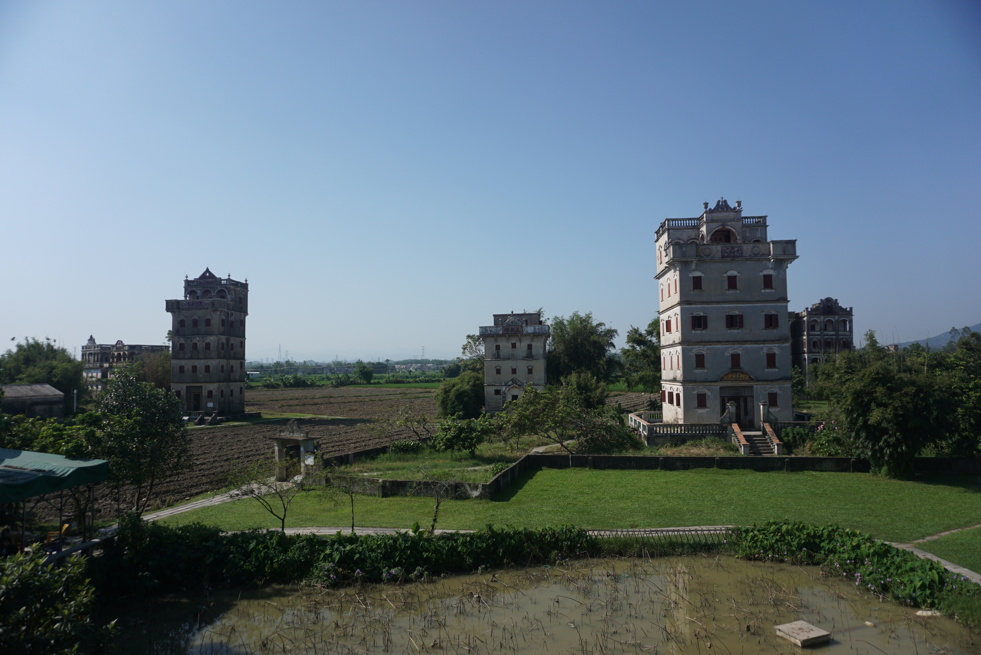 Diaolou towers in Zili Village, Kaiping, surrounded by fields