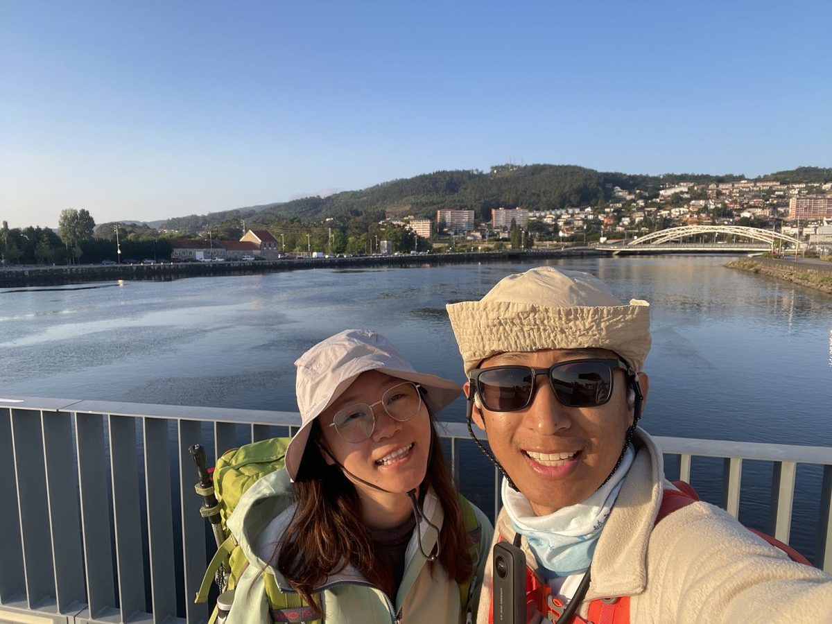 Xi Yu and travel companion at a scenic viewpoint in China